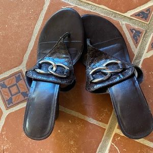 Black, wedge type heel. Size 6.5. Worn but still has life in them. Brand unknown